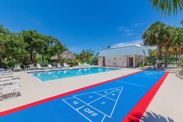 a view of a swimming pool with sitting area