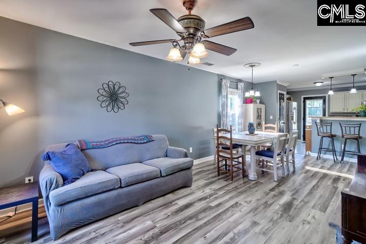 209 Eagle Pointe Drive Chapin, SC 29036 - Photo 6 of 40 a living room with furniture and a wooden floor