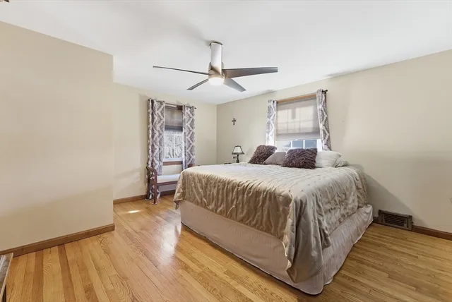 a bed room with a bed and a window