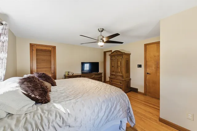 a bed room with a bed and a window