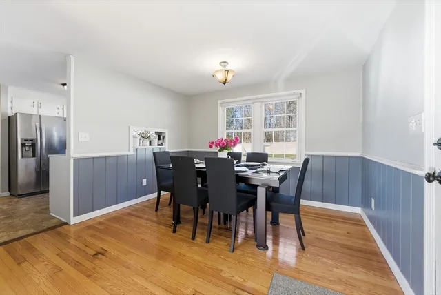 a living room with furniture a ceiling fan and a rug