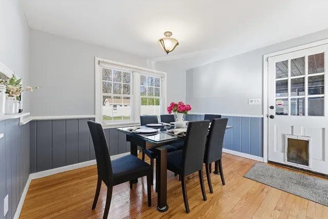 a bedroom with furniture and a large window