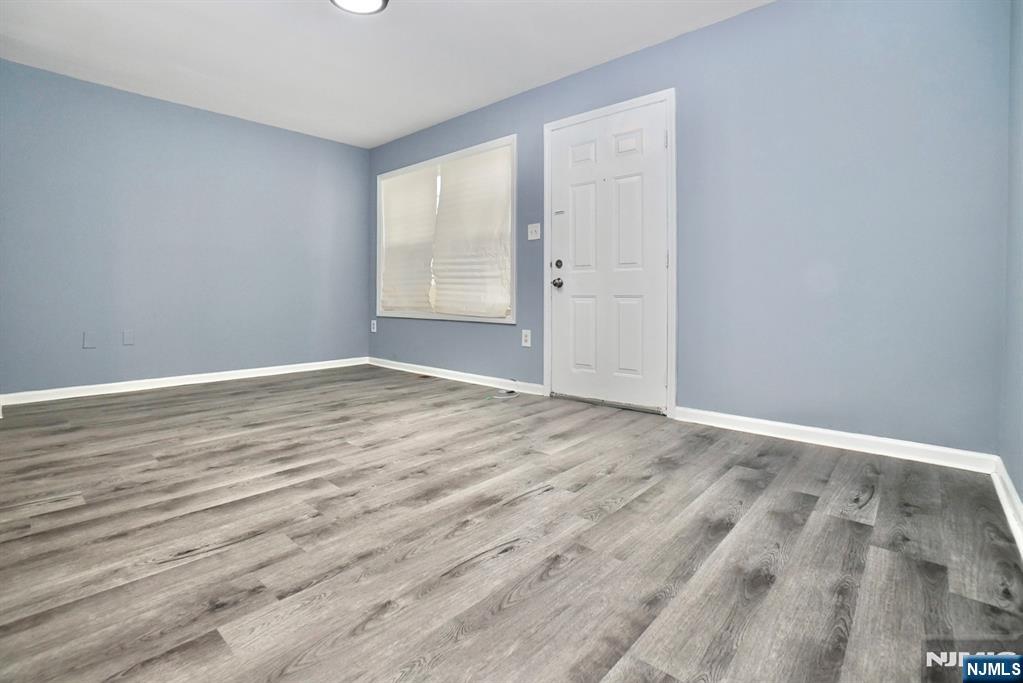 51 Demarest Street Newark, NJ 07112 - Photo 4 of 9 wooden floor in an empty room