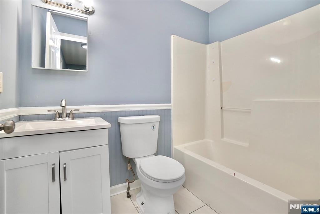 51 Demarest Street Newark, NJ 07112 - Photo 9 of 9 a bathroom with a sink toilet and shower