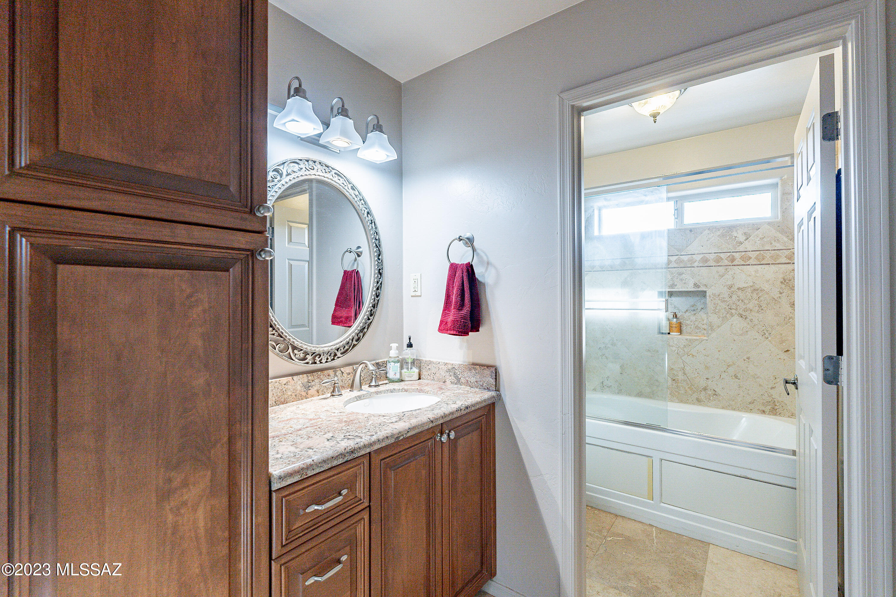 1135 Via San Francisco Rio Rico, AZ 85648 - Photo 21 of 29 a bathroom with a sink vanity mirror and tub