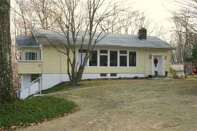 58 Blue Ridge Road Ridgefield, CT 06877 - Photo 1 of 1 front view of a house with a yard
