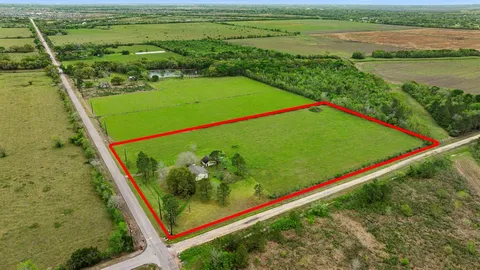 a view of a field with an outdoor space