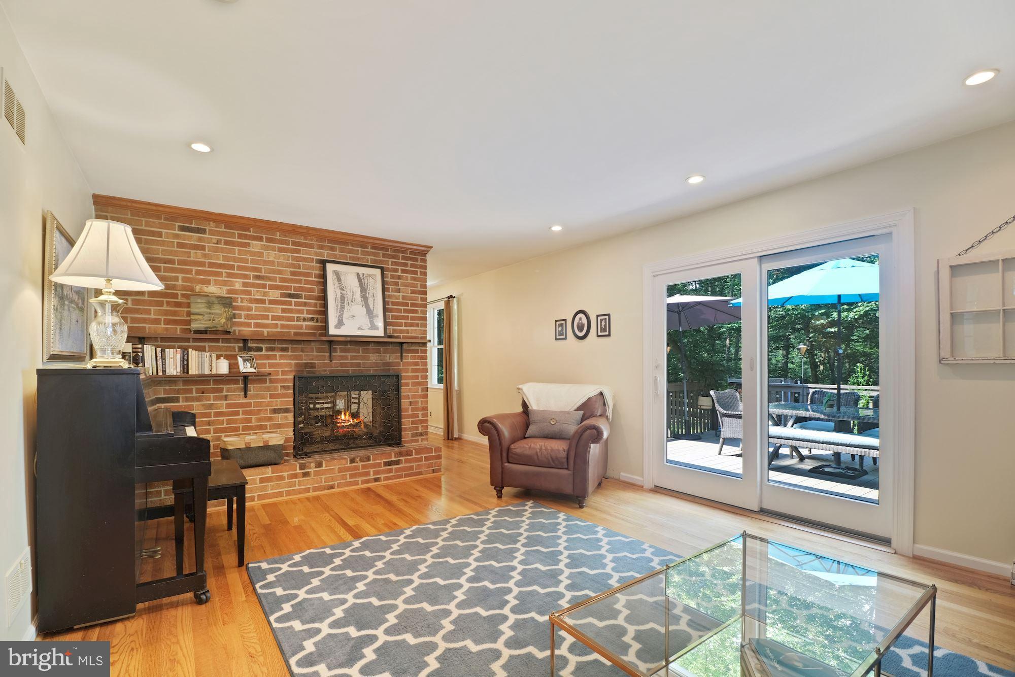 966 Lee Road Kennett Square, PA 19348 - Photo 24 of 51 Formal living up w/ fireplace w/ view to deck