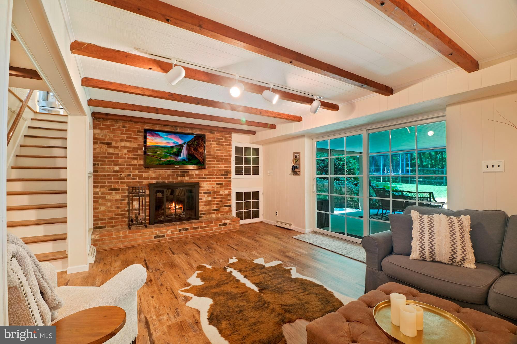 966 Lee Road Kennett Square, PA 19348 - Photo 40 of 51 Lower level family room w/ view to patio