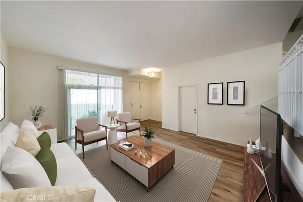 a living room with furniture rug and window