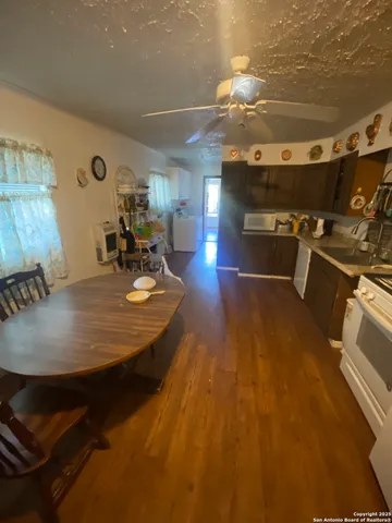 a dining room with a table and chairs