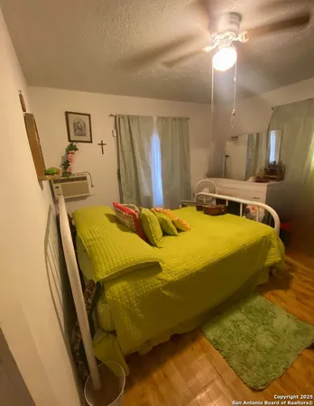 a bedroom with a bed and a chandelier