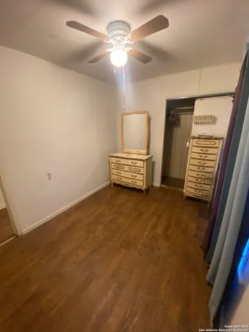 a view of livingroom with hardwood floor and ceiling fan