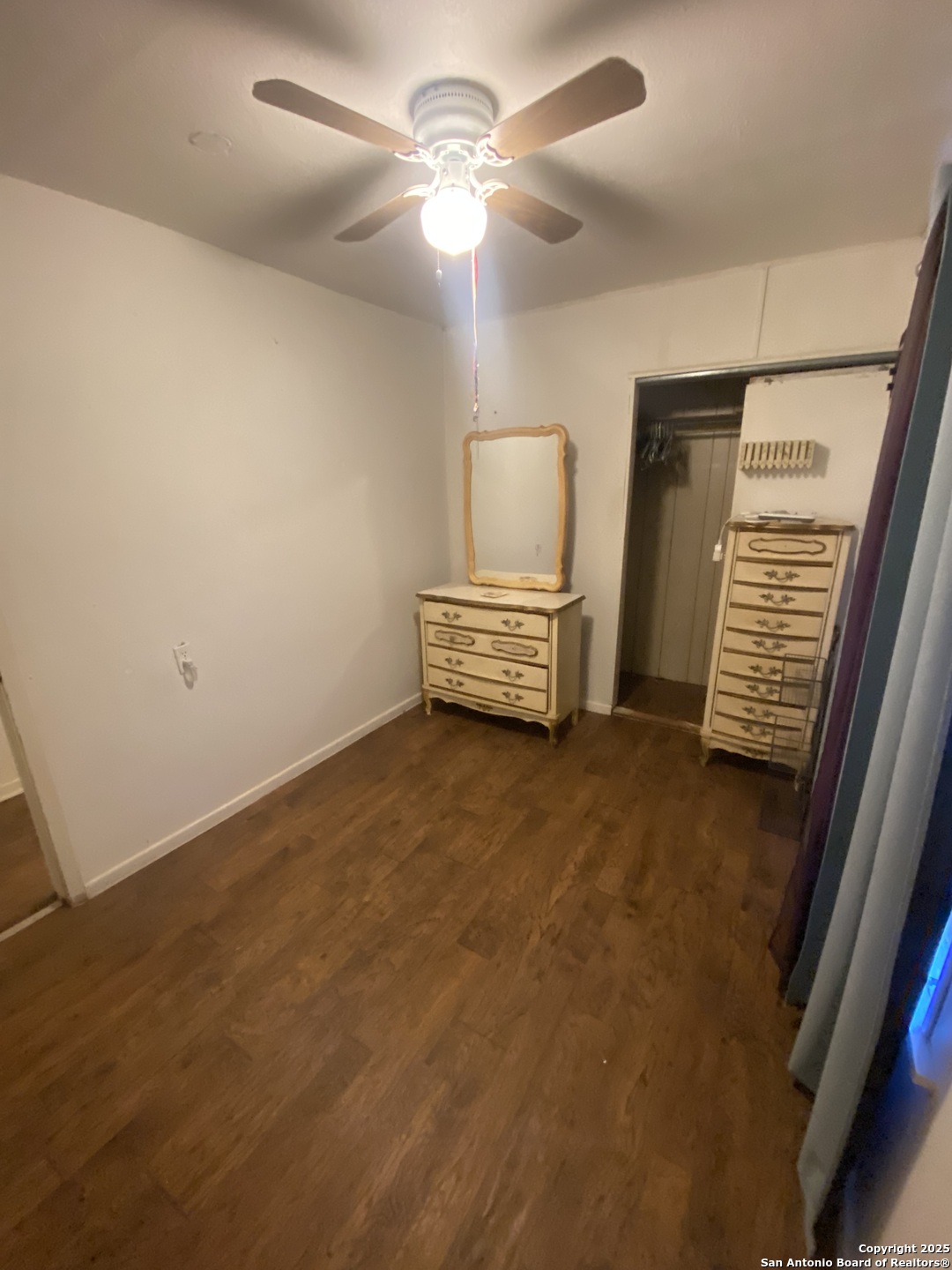 516 West Dunlap Avenue Sabinal, TX 78881 - Photo 16 of 23 a view of livingroom with hardwood floor and ceiling fan