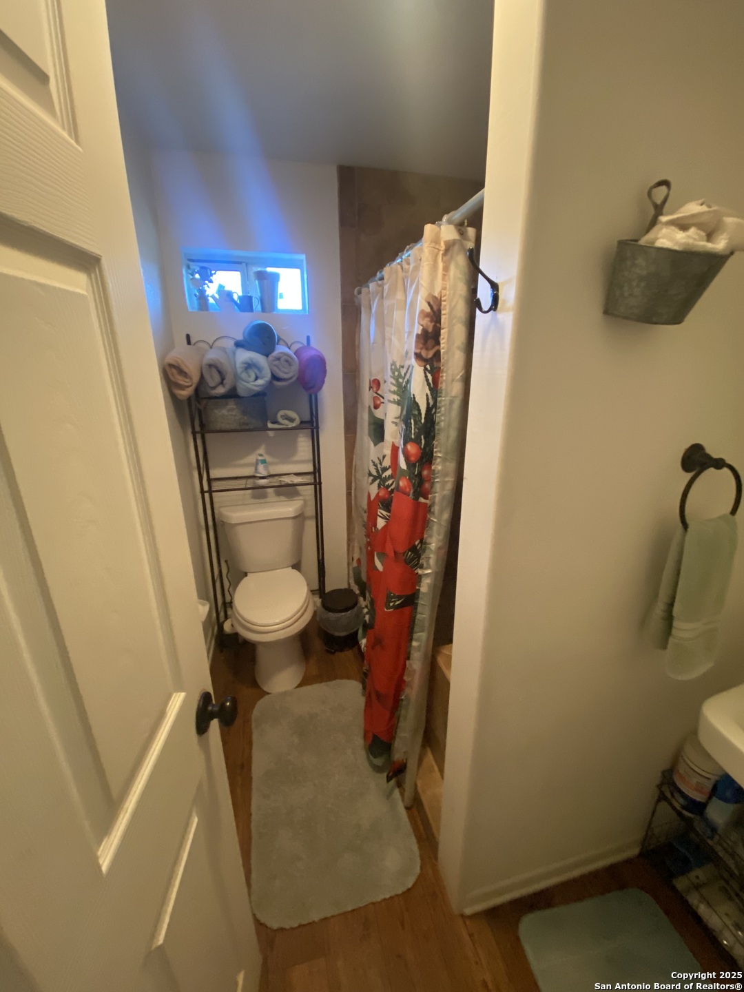 516 West Dunlap Avenue Sabinal, TX 78881 - Photo 17 of 23 a bathroom with a toilet and a shower