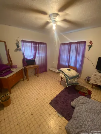a living room with furniture rug and a lamp
