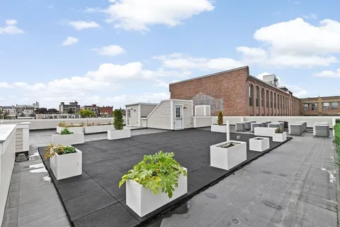a view of a terrace with sitting area
