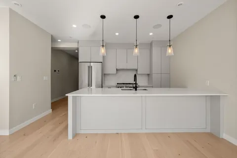 a view of a room with kitchen island
