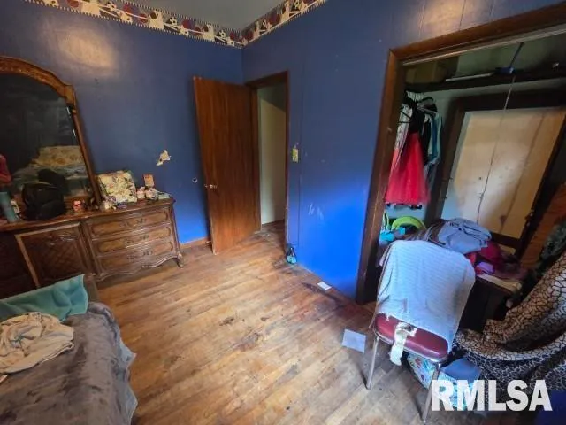 a bedroom with bed and a window