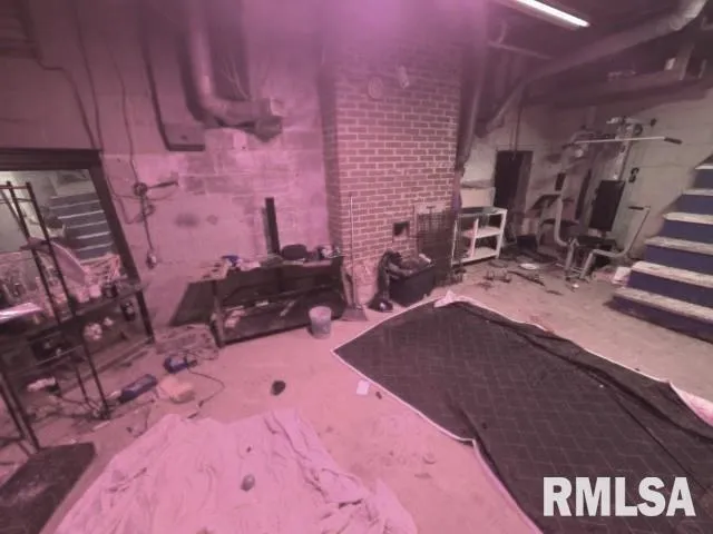 a bed room with a bed and a television