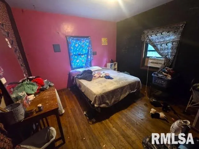 a bed room with a bed and a television