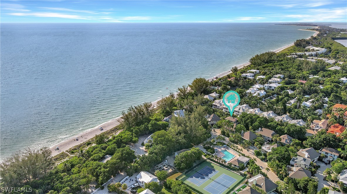 10 Sunset Captiva Lane Captiva, FL 33924 - Photo 1 of 33 a view of a lake with beach