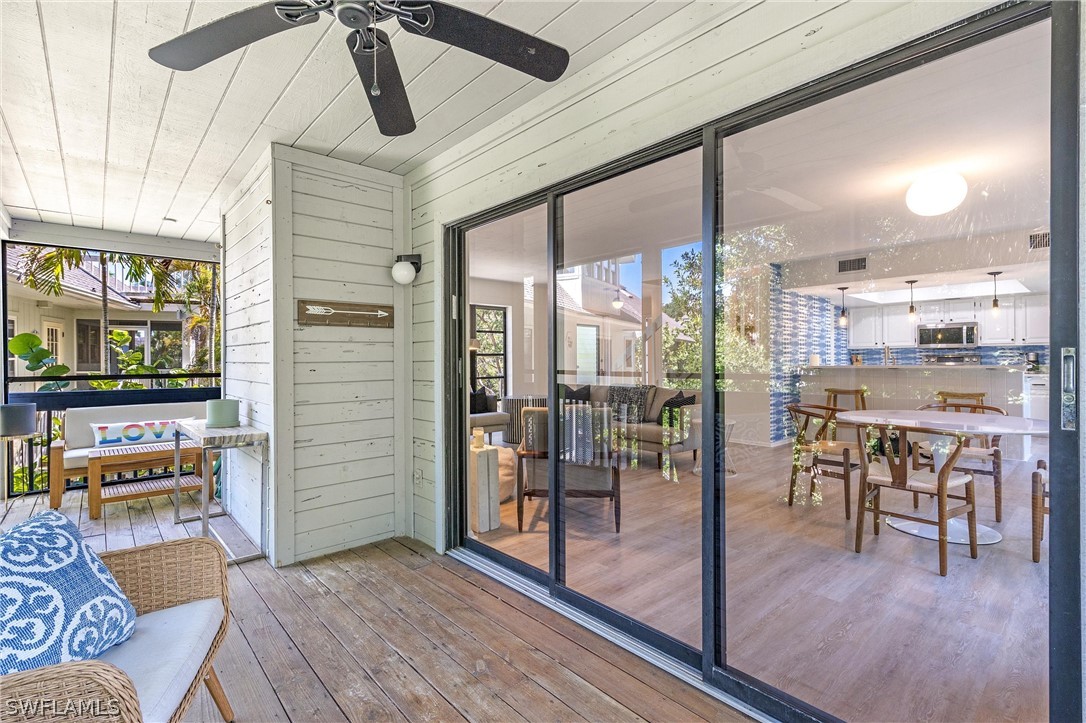 10 Sunset Captiva Lane Captiva, FL 33924 - Photo 15 of 33 a view of a dining room with furniture window and wooden floor