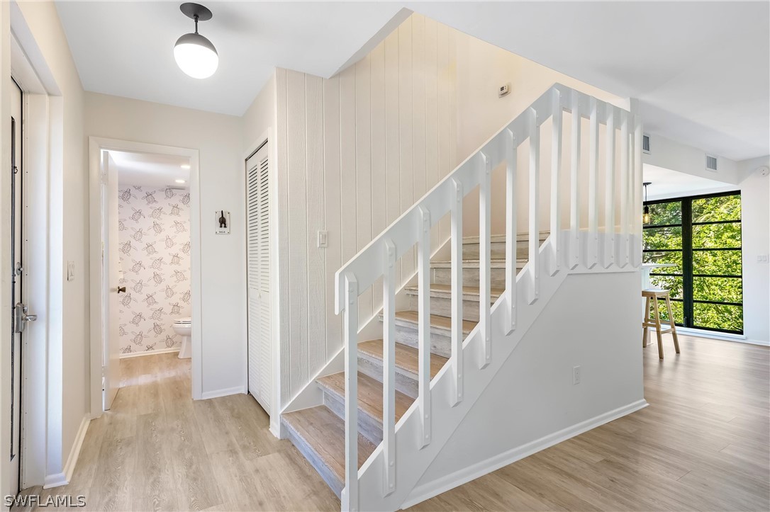 10 Sunset Captiva Lane Captiva, FL 33924 - Photo 16 of 33 en view interior of a house with wooden floor windows and outdoor view