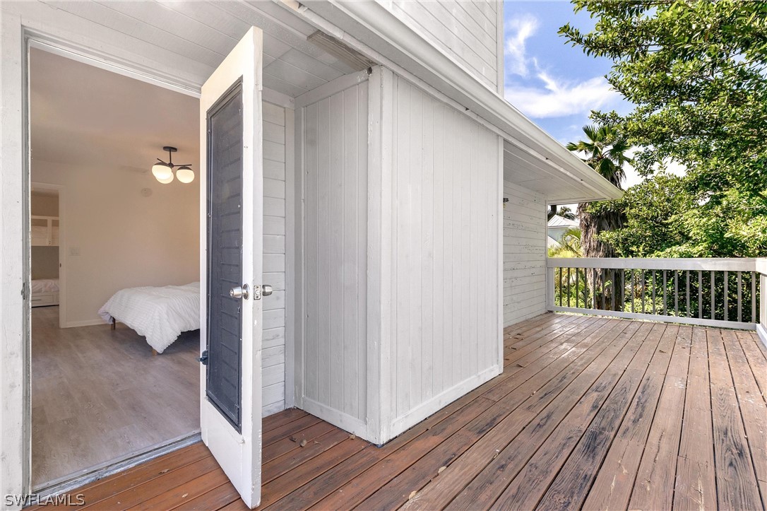 10 Sunset Captiva Lane Captiva, FL 33924 - Photo 20 of 33 a view of a deck with wooden floor and fence