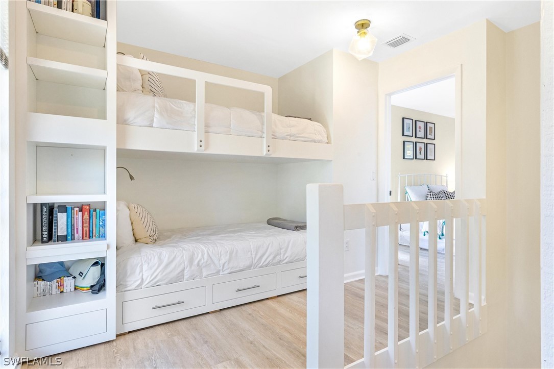 10 Sunset Captiva Lane Captiva, FL 33924 - Photo 22 of 33 a bedroom with a bed and a window