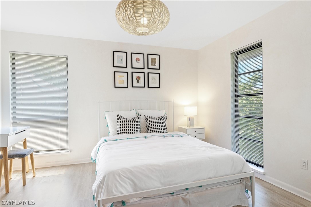 10 Sunset Captiva Lane Captiva, FL 33924 - Photo 24 of 33 a bedroom with a bed and a window