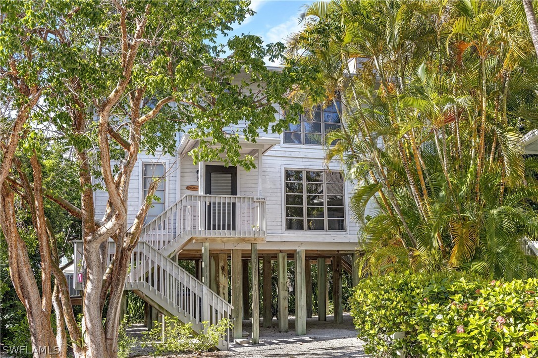 10 Sunset Captiva Lane Captiva, FL 33924 - Photo 4 of 33 front view of a house with a tree