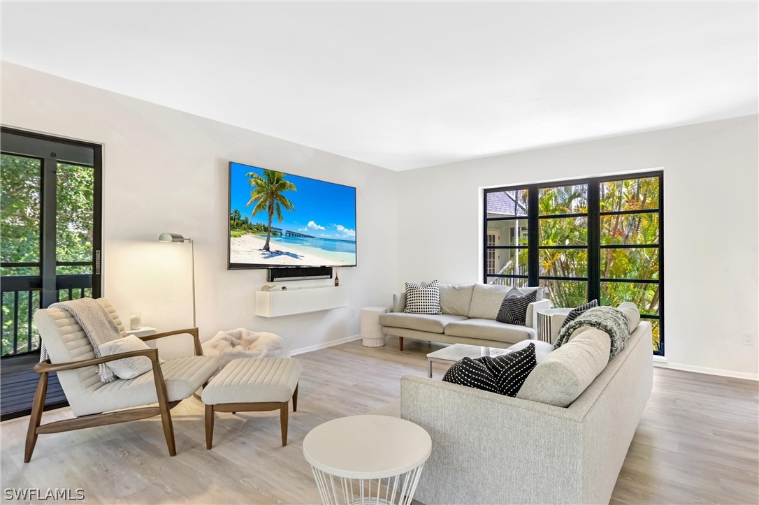 10 Sunset Captiva Lane Captiva, FL 33924 - Photo 5 of 33 a living room with furniture and a large window