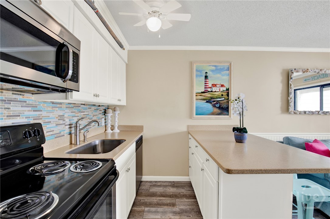 1217 Bay Street, Unit 105B Tybee Island, GA 31328 - Photo 11 of 46 Full Sized Kitchen with Stainless Steel Appliances
