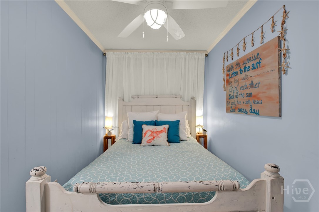 1217 Bay Street, Unit 105B Tybee Island, GA 31328 - Photo 14 of 46 Bedroom with Queen Bed Open to Hallway with Spacio