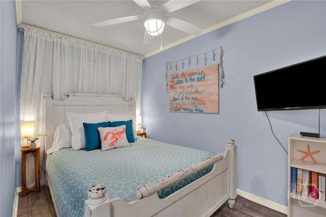 1217 Bay Street, Unit 105B Tybee Island, GA 31328 - Photo 15 of 46 Bedroom with Queen Bed Open to Hallway with Spacio