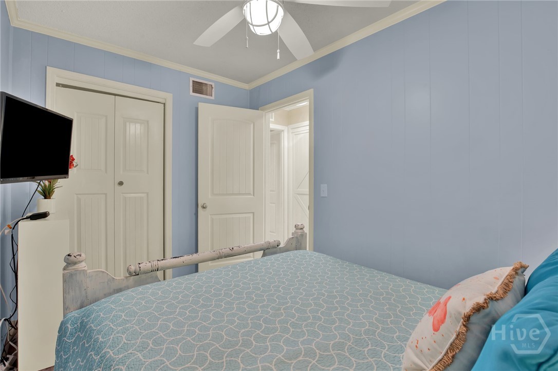 1217 Bay Street, Unit 105B Tybee Island, GA 31328 - Photo 17 of 46 Bedroom with Queen Bed Open to Hallway with Spacio