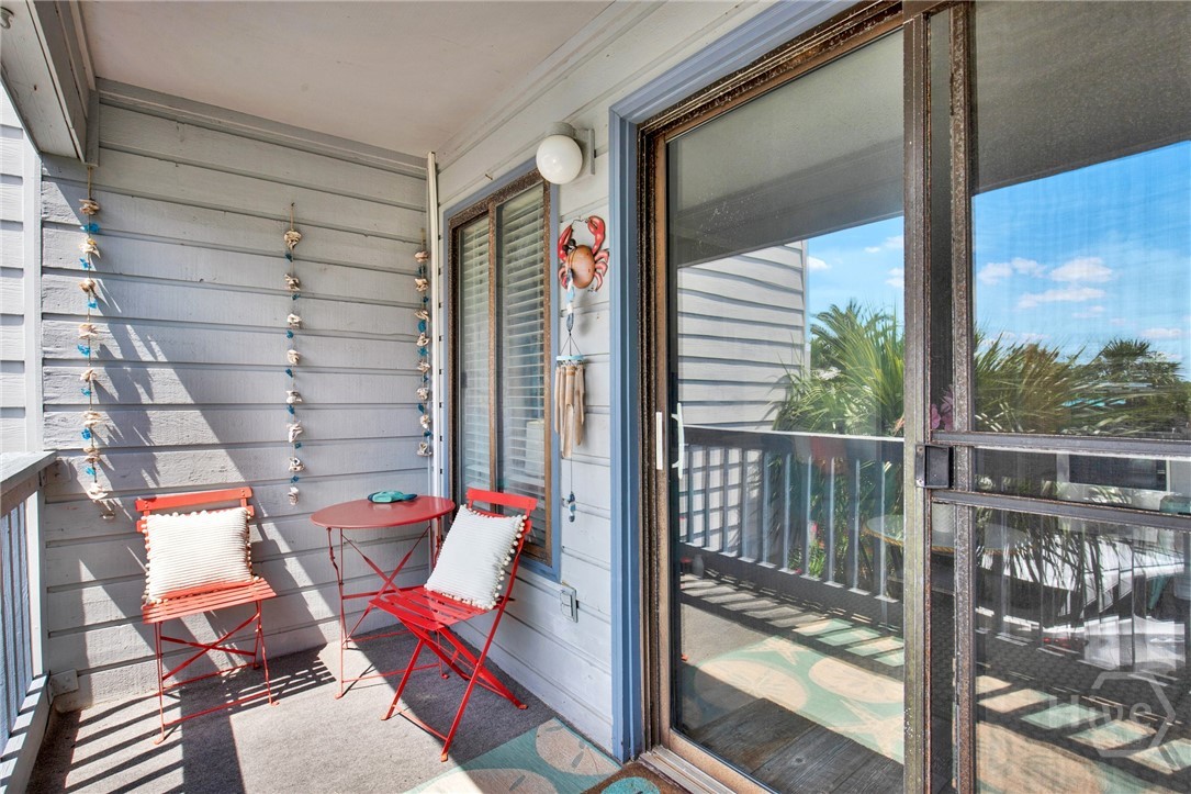 1217 Bay Street, Unit 105B Tybee Island, GA 31328 - Photo 22 of 46 Balcony with Sunset & Partial Water Views!