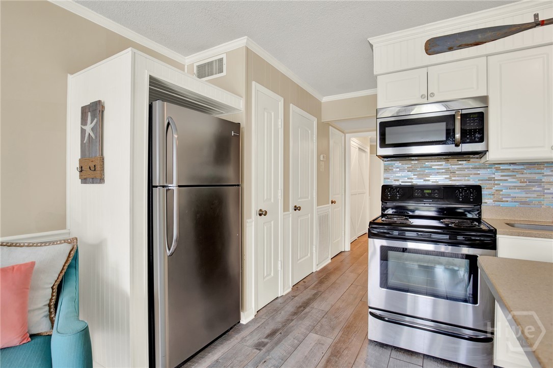 1217 Bay Street, Unit 105B Tybee Island, GA 31328 - Photo 10 of 46 Full Sized Kitchen with Stainless Steel Appliances