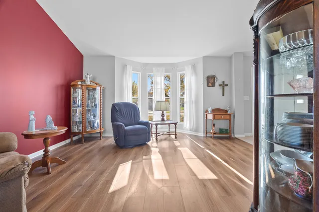 a view of a dining room with furniture wooden floor and chandelier