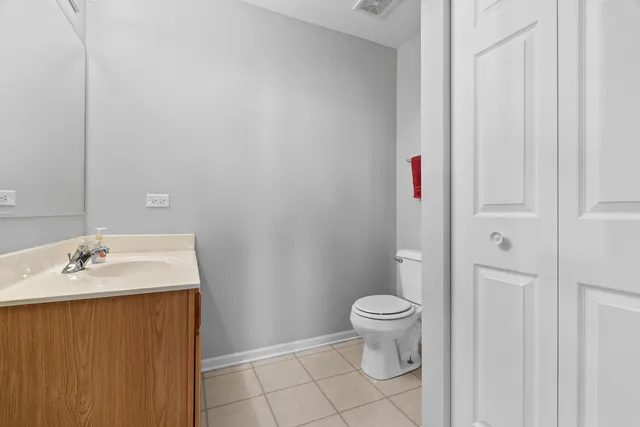 a kitchen with a stove a sink and a refrigerator