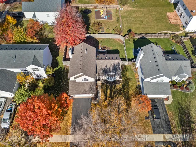 an aerial view of residential houses with outdoor space