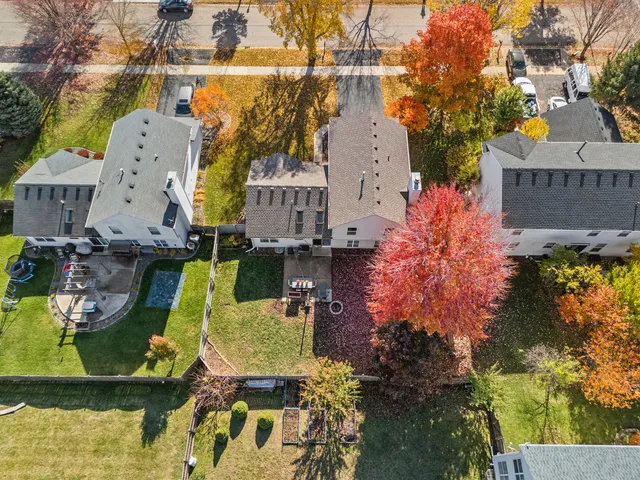 an aerial view of residential houses with outdoor space
