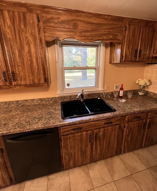 142 Blanche Street Springfield, MA 01119 - Photo 6 of 27 a kitchen with stainless steel appliances a sink dishwasher a stove a refrigerator and cabinets