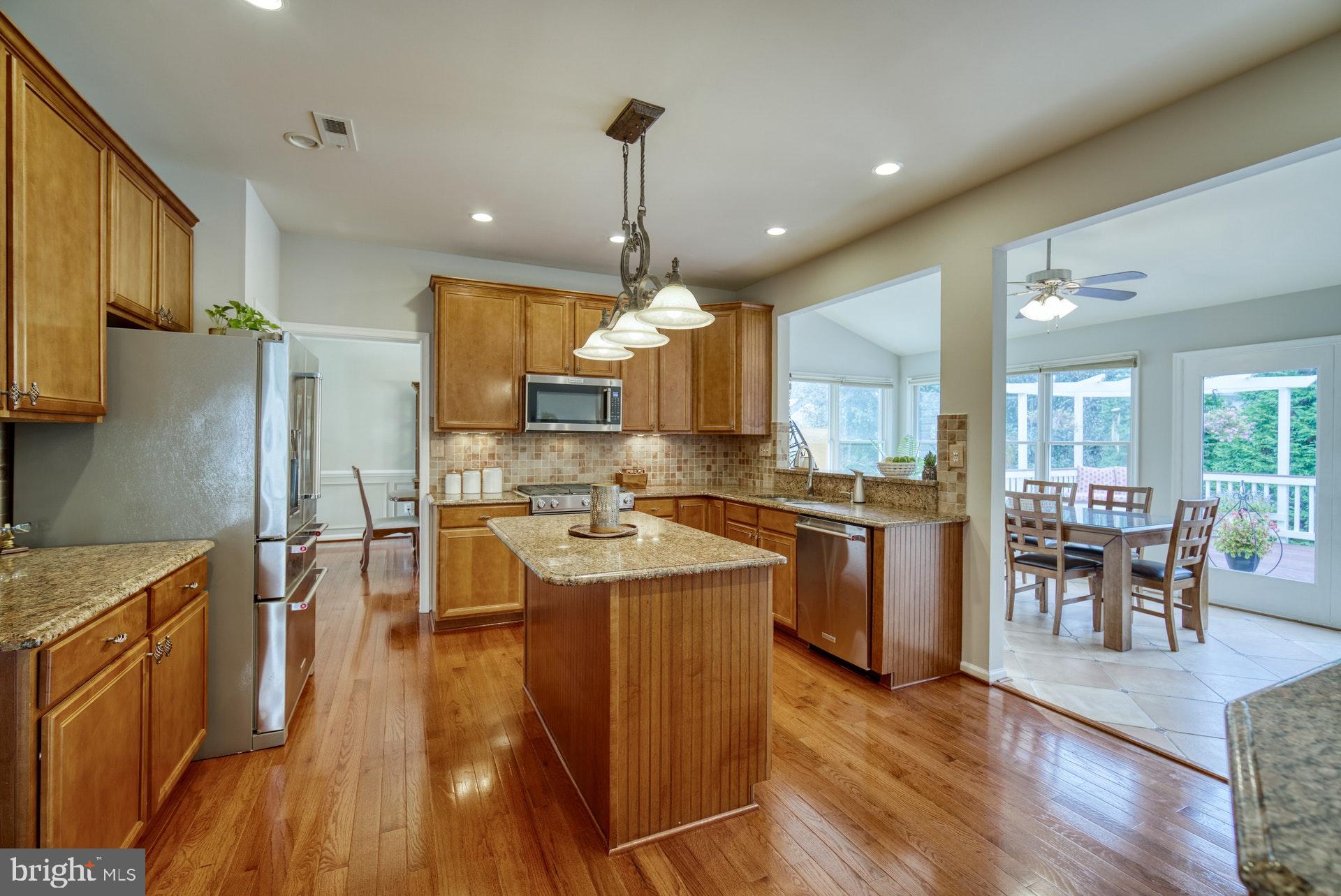 10868 Grovehampton Court Reston, VA 20194 - Photo 6 of 48 Kitchen into Sunroom