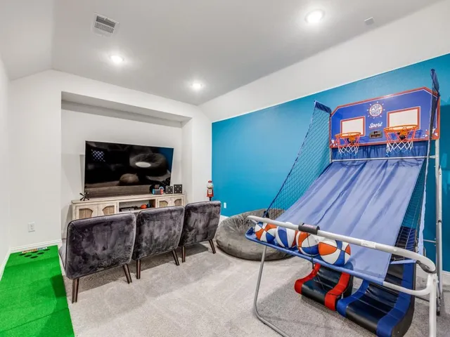 a room with furniture and a flat screen tv