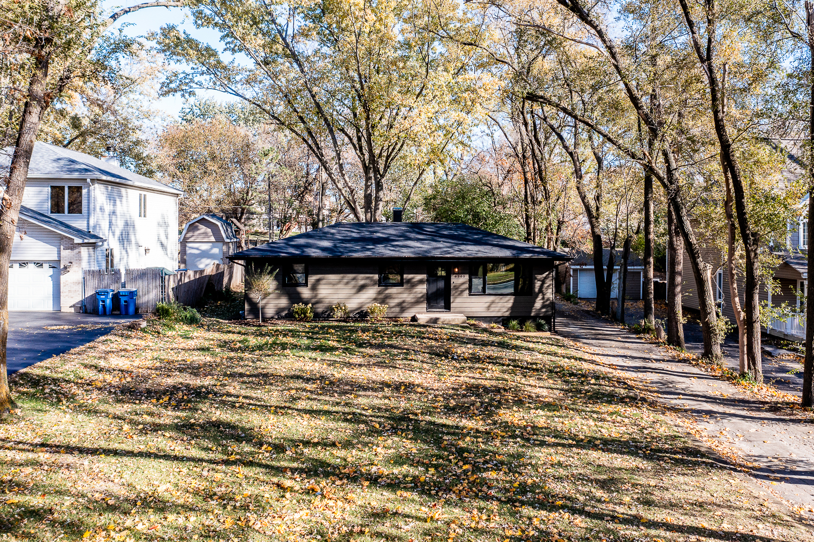 6205 Belmont Road Downers Grove, IL 60516 - Photo 2 of 30 a view of a house with a yard covered with snow
