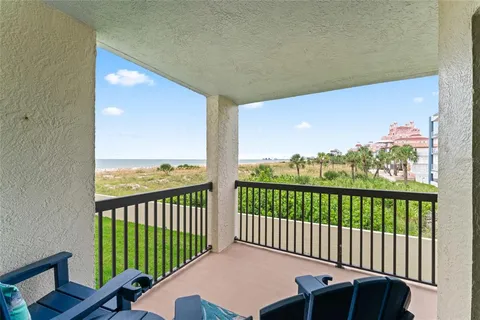 a view of a balcony with furniture