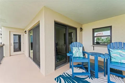 a view of a livingroom with dining room and furniture