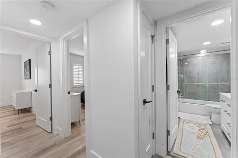 a bathroom with a shower and a glass door
